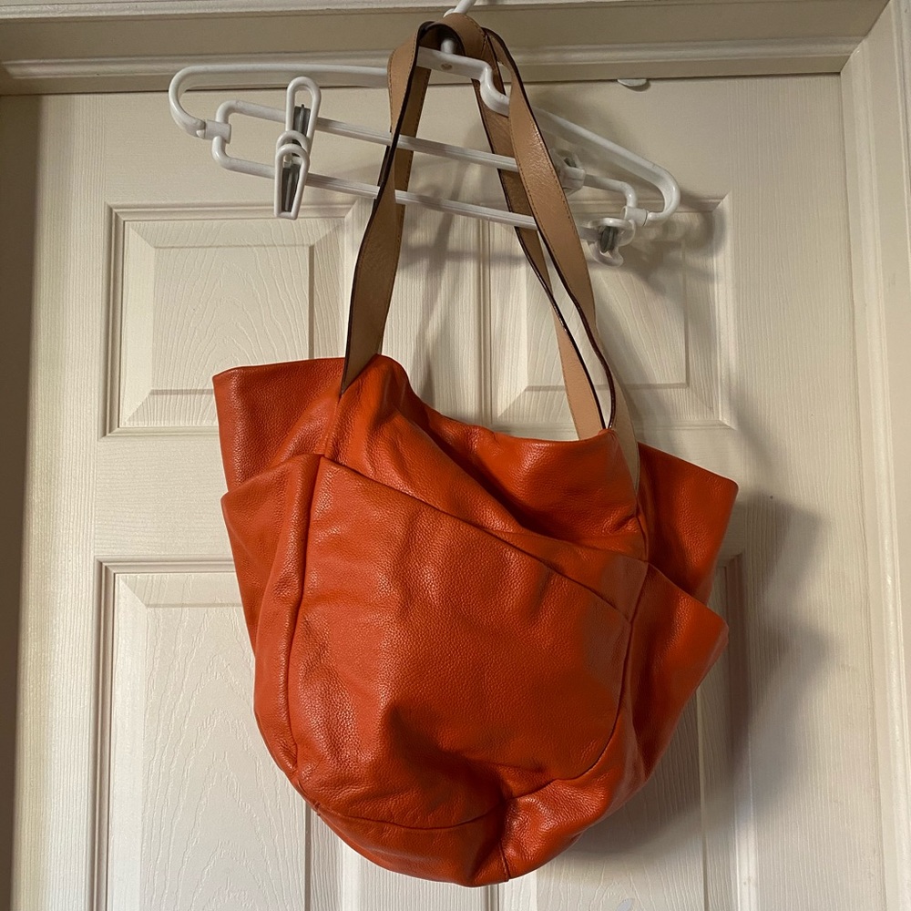 Olivia Harris  by Joy Gryson orange bag.